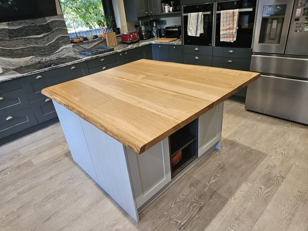 Oak kitchen island made out of 4 large Oak slabs. Joined, sanded and oiled in Osmo oil. Measuring 1400 x 1300 x 44mm thick.