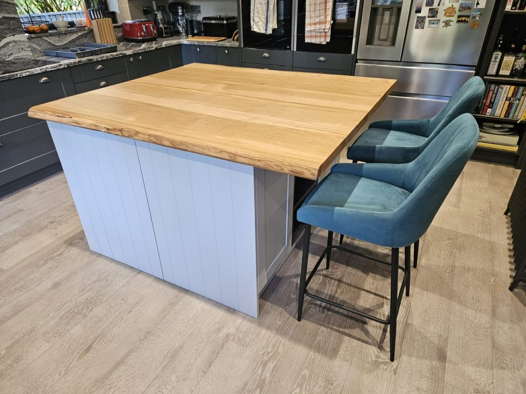Oak kitchen island made out of 4 large Oak slabs. Joined, sanded and oiled in Osmo oil. Measuring 1400 x 1300 x 44mm thick.