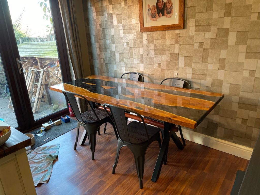 Yew dining table with resin top coat